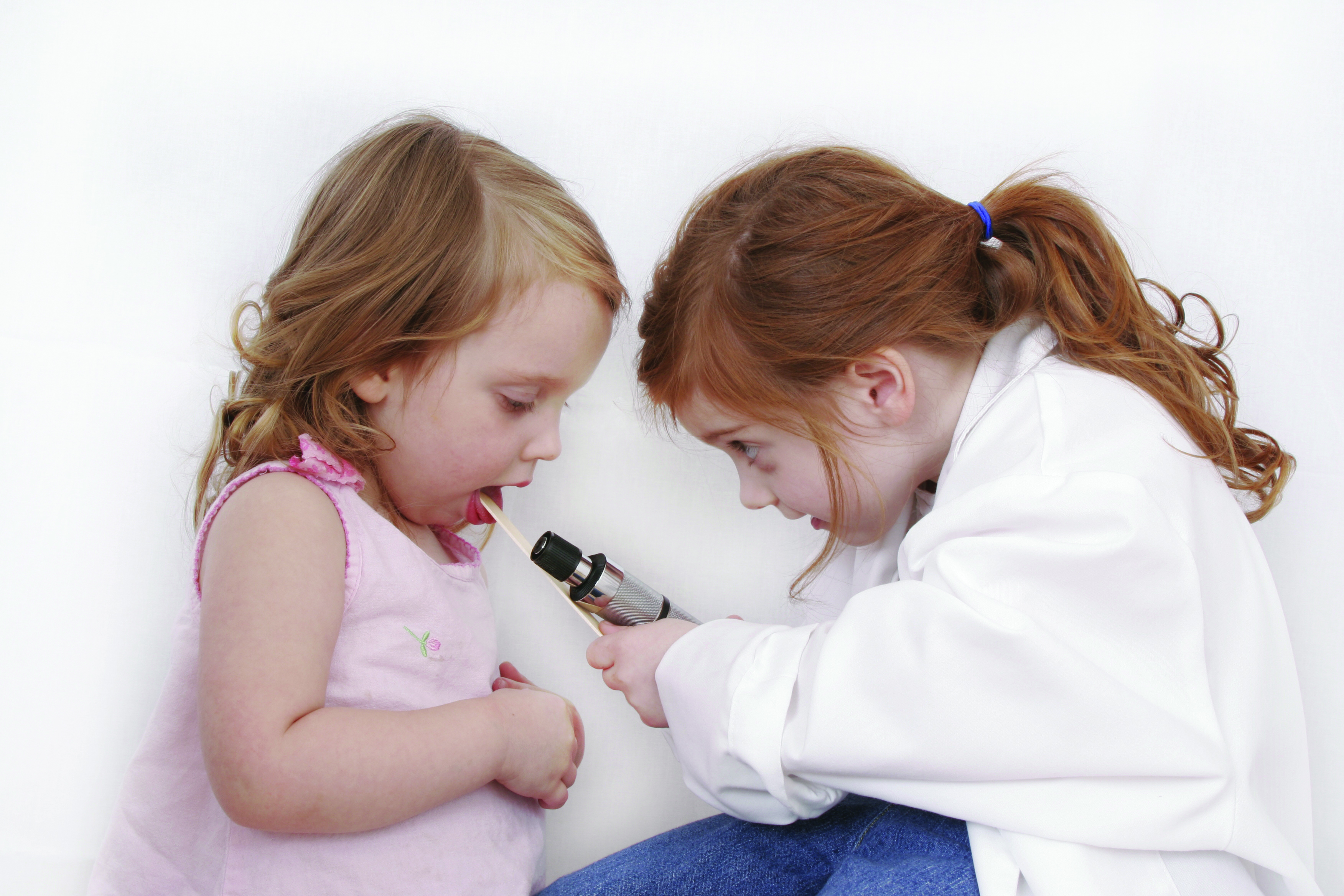 Two girls playing doctors