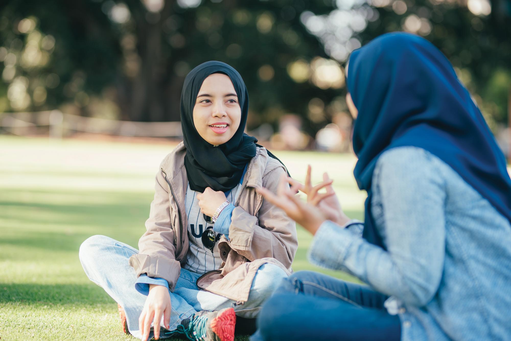 Two girls in hijabs talking in Kings Park