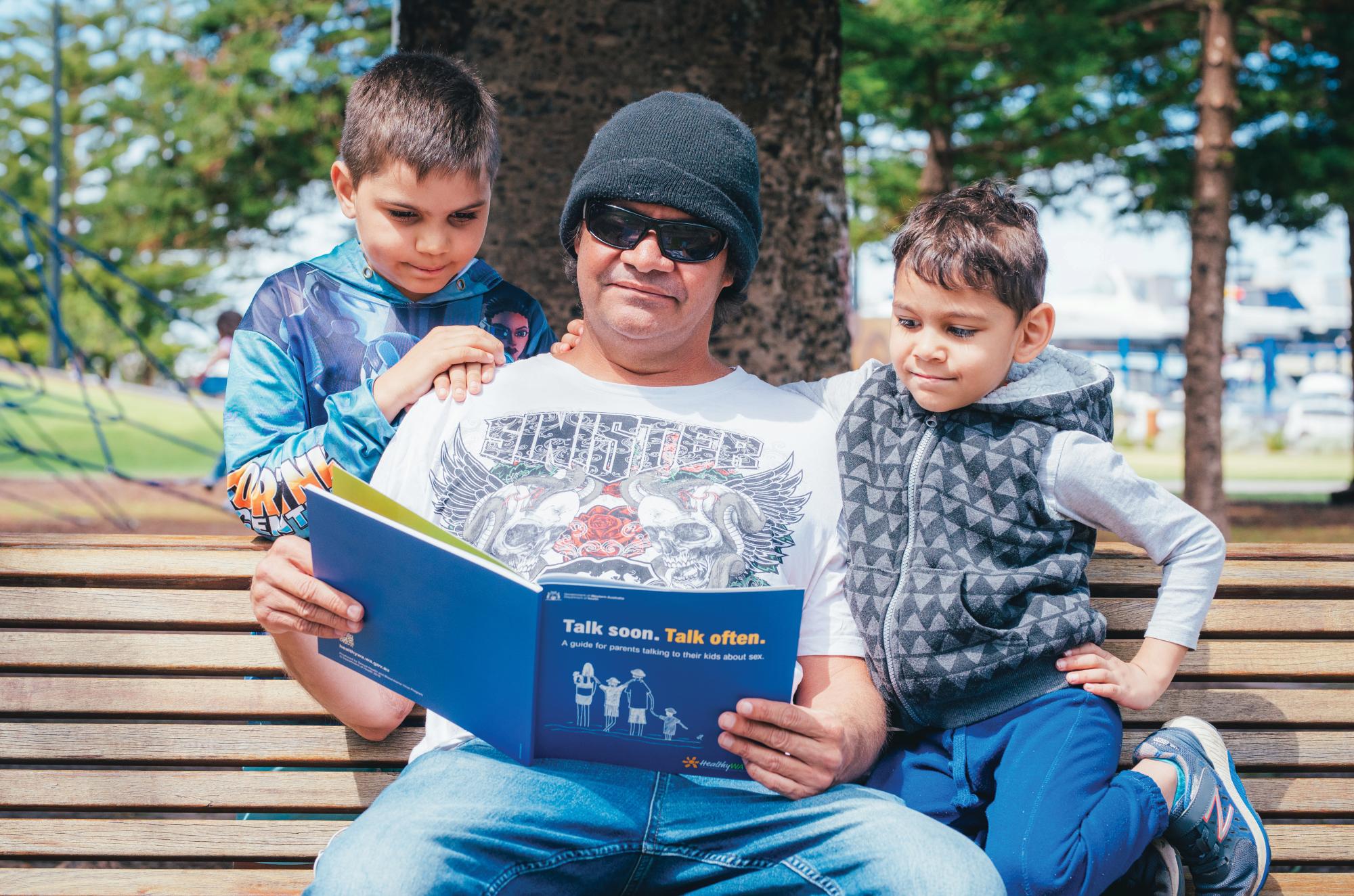 Dad and boys reading